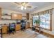 Bright office space with built-in shelves, a large window, and views of the outdoor space at 1667 Quail Run, Conyers, GA 30094
