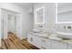 A luxury bathroom with double sinks, floating vanity, and hexagon marble tile accents at 1711 Summit Glen Ln, Atlanta, GA 30329
