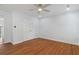 Spacious bedroom with hardwood floors, crown molding, and a ceiling fan at 1711 Summit Glen Ln, Atlanta, GA 30329