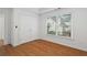 Bedroom featuring hardwood floors, neutral paint, and a large window at 1711 Summit Glen Ln, Atlanta, GA 30329