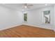 Bright bedroom features hardwood floors, neutral walls, recessed lighting, and natural light from two windows at 1711 Summit Glen Ln, Atlanta, GA 30329