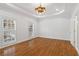 Bedroom with hardwood floors, recessed lighting, and a window with a view of the backyard at 1711 Summit Glen Ln, Atlanta, GA 30329