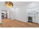 Dining room with serving area includes hardwood floors, modern lighting and access to kitchen at 1711 Summit Glen Ln, Atlanta, GA 30329