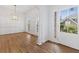 Elegant dining room featuring hardwood floors, decorative molding, and a stylish chandelier at 1711 Summit Glen Ln, Atlanta, GA 30329