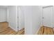 Hallway featuring hardwood floors and access to different rooms at 1711 Summit Glen Ln, Atlanta, GA 30329