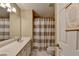 Bathroom featuring a double vanity and shower with striped curtain at 2515 Gadsen Walk, Duluth, GA 30097