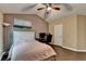 Vaulted ceiling bedroom boasts ample natural light, ceiling fan, wood floors, and a convenient workspace at 2515 Gadsen Walk, Duluth, GA 30097