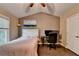 Comfortable bedroom with vaulted ceiling, ceiling fan, hard wood floors, and a dedicated work area at 2515 Gadsen Walk, Duluth, GA 30097