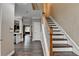 Open hallway featuring hardwood floors and stairs with a wooden banister at 2515 Gadsen Walk, Duluth, GA 30097
