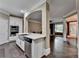 Modern kitchen with white cabinets, stainless steel appliances, and an island with a sink at 2515 Gadsen Walk, Duluth, GA 30097