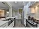Modern kitchen featuring stainless steel appliances, white cabinets, and hardwood floors at 2515 Gadsen Walk, Duluth, GA 30097