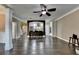 Beautiful living room with dark hardwood floors leading to a kitchen with countertop seating at 2515 Gadsen Walk, Duluth, GA 30097