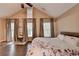 Bright main bedroom with three large windows and vaulted ceiling at 2515 Gadsen Walk, Duluth, GA 30097