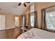 Main bedroom with vaulted ceiling, hardwood floors, many windows, and access to the bathroom at 2515 Gadsen Walk, Duluth, GA 30097