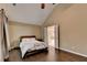 Main bedroom features vaulted ceilings, hardwood floors, ensuite bath, and neutral paint at 2515 Gadsen Walk, Duluth, GA 30097