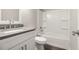 Bathroom featuring a modern vanity with a quartz countertop, tiled shower, and modern fixtures at 3321 Georgian Woods Cir, Decatur, GA 30034