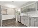 Kitchen with stainless steel appliances, subway tile backsplash, modern gray cabinets, and hardwood floors at 3321 Georgian Woods Cir, Decatur, GA 30034
