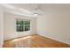 This bedroom features hardwood flooring, a ceiling fan and a window at 4254 River Green Dr # 613, Atlanta, GA 30327