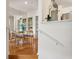 Bright dining room with wood floors, mirrored wall, and a view into the kitchen at 4254 River Green Dr # 613, Atlanta, GA 30327