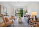 Bright living room with hardwood floors, balcony access and stylish decor at 4254 River Green Dr # 613, Atlanta, GA 30327