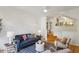 Cozy living room with hardwood floors and an open view to the modern kitchen at 4254 River Green Dr # 613, Atlanta, GA 30327