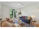 Bright living room with hardwood floors, balcony access and stylish decor at 4254 River Green Dr # 613, Atlanta, GA 30327