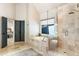 Bright bathroom featuring a soaking tub and glass-enclosed shower at 625 Wynfield Ct, Roswell, GA 30076