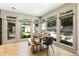 Bright dining area with large windows offering views of the backyard at 625 Wynfield Ct, Roswell, GA 30076