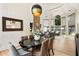 Open-concept home with dining area adjacent to living room providing a seamless flow at 625 Wynfield Ct, Roswell, GA 30076