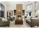 Inviting living room features a stone fireplace and built-in shelving creating a cozy and stylish ambiance at 625 Wynfield Ct, Roswell, GA 30076