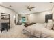 Spacious primary bedroom with a seating area, fireplace, neutral color palette, and ensuite bathroom at 625 Wynfield Ct, Roswell, GA 30076