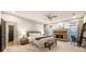 Comfortable primary bedroom suite featuring a stone fireplace, sitting area, and ensuite bathroom at 625 Wynfield Ct, Roswell, GA 30076