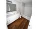 Bright bathroom with a tub-shower combo, white vanity, and hardwood floors at 6817 Blackstone Pl # 16, Mableton, GA 30126
