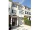 Charming townhouse featuring a brick facade, attached garage, and a welcoming entrance at 6817 Blackstone Pl # 16, Mableton, GA 30126