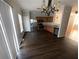Open kitchen area with stainless steel appliances, wood cabinets and hardwood floors at 6817 Blackstone Pl # 16, Mableton, GA 30126