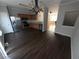 Open kitchen area with stainless steel appliances, wood cabinets and hardwood floors at 6817 Blackstone Pl # 16, Mableton, GA 30126