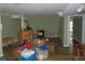 Unfinished basement with olive green walls, wood-look floor and doorway to another room at 2448 Sherbrooke Ne Ct, Atlanta, GA 30345