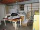 Unfinished basement with exposed ceiling, shelves, a freezer and washer/dryer at 2448 Sherbrooke Ne Ct, Atlanta, GA 30345