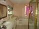 Bathroom with a vanity, a soaking tub, and a window for natural light at 2448 Sherbrooke Ne Ct, Atlanta, GA 30345
