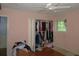 Bedroom features a closet, window, hardwood floors, and natural light for a warm ambiance at 2448 Sherbrooke Ne Ct, Atlanta, GA 30345