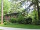 Brick home with mature landscaping in a wooded setting has a charming aesthetic at 2448 Sherbrooke Ne Ct, Atlanta, GA 30345