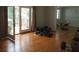 Sun-filled living room featuring hardwood floors and access to a covered porch through French doors at 2448 Sherbrooke Ne Ct, Atlanta, GA 30345