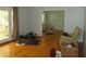 Bright living room with gleaming hardwood floors and view into the adjacent dining room at 2448 Sherbrooke Ne Ct, Atlanta, GA 30345