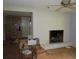 Bright living room with a fireplace, hardwood floors, and access to other rooms at 2448 Sherbrooke Ne Ct, Atlanta, GA 30345