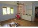 Inviting living area with natural light, built-in shelves and cabinets, and a ceiling fan at 2448 Sherbrooke Ne Ct, Atlanta, GA 30345