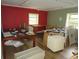 Room with red and green walls, two windows and two desks at 2448 Sherbrooke Ne Ct, Atlanta, GA 30345