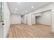 Large finished basement with stylish flooring, recessed lighting, and staircase access at 5236 Forest Brook Pkwy, Marietta, GA 30068