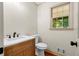 Powder room with oak vanity and brushed-nickel faucet at 5236 Forest Brook Pkwy, Marietta, GA 30068