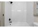 Bathroom with white subway tile, a bathtub, and a shower with a black shower head at 5236 Forest Brook Pkwy, Marietta, GA 30068