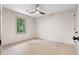 Spacious bedroom with neutral carpet, a ceiling fan, and a window providing natural light at 5236 Forest Brook Pkwy, Marietta, GA 30068